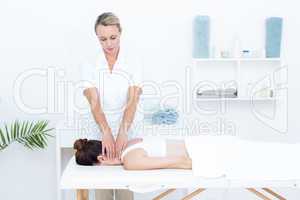 Physiotherapist doing neck massage