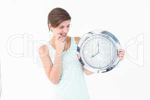 Stressed woman looking at clock