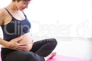 Pregnant woman keeping in shape