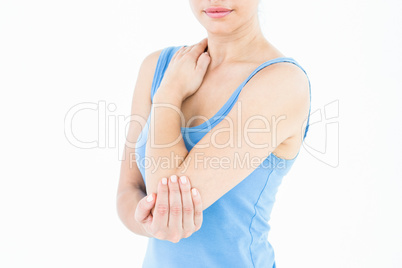 Woman touching her painful elbow