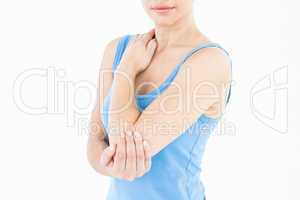 Woman touching her painful elbow