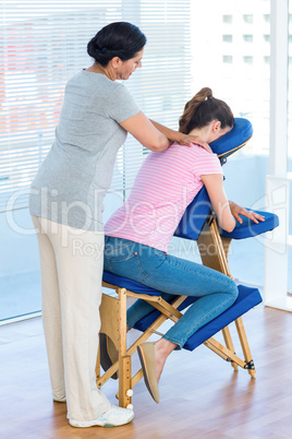 Woman having shoulders massage