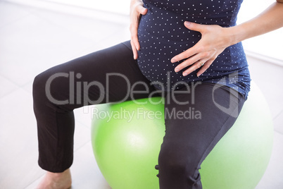 Pregnant woman keeping in shape