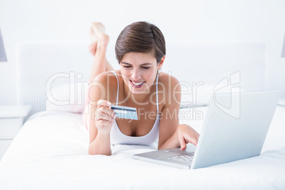 Happy woman doing online shopping