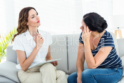 Depressed woman talking with her therapist