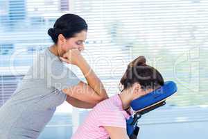 Woman having back massage