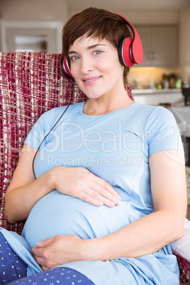 Pregnant woman listening to music