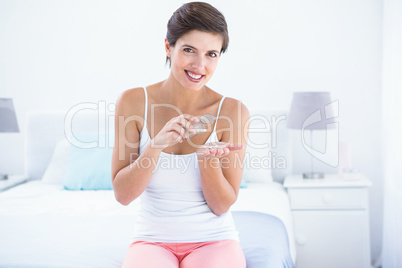 Attractive woman taking pills