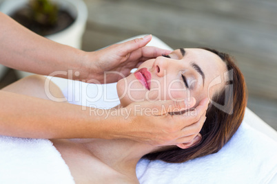 Brunette receiving head massage