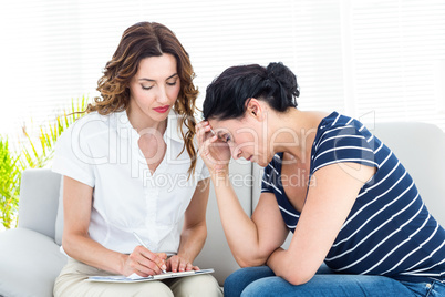 Depressed woman talking with her therapist