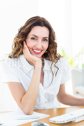 Smiling businesswoman looking at camera