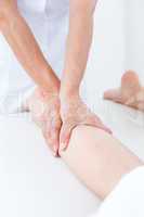 Physiotherapist doing leg massage