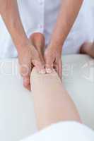 Physiotherapist doing leg massage