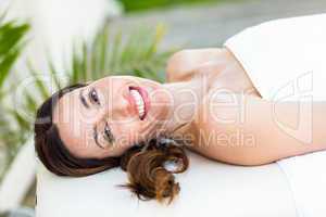 Calm woman lying on massage table