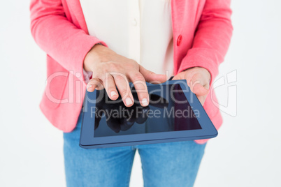 Elegant brunette using tablet