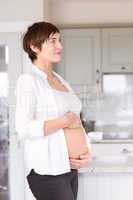 Pregnant woman holding her bump