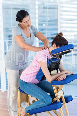 Woman having neck massage