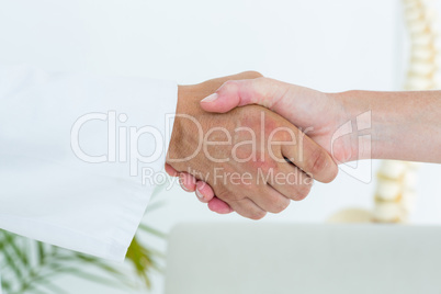 Doctor shaking hand of his patient