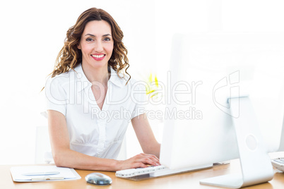 Smiling businesswoman working with computer