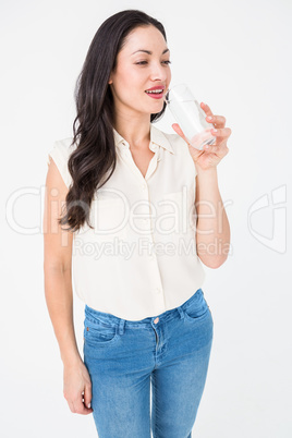 Pretty brunette drinking water