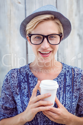 Pretty blonde woman holding goblet