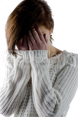 Sad pretty brunette crying with head on hands