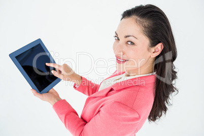 Elegant brunette using tablet