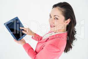 Elegant brunette using tablet