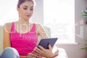 Casual woman using her tablet pc