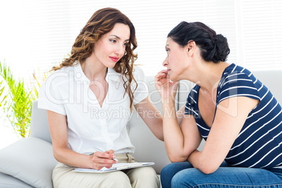 Depressed woman talking with her therapist