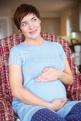 Pregnant woman holding her bump