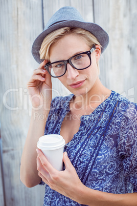 Pretty blonde woman holding goblet