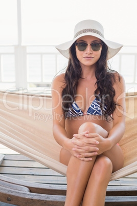 Pretty brunette relaxing on a hammock