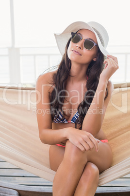 Pretty brunette relaxing on a hammock