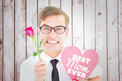 Composite image of geeky hipster holding a red rose and heart ca