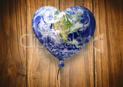 Composite image of heart shaped earth