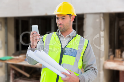 Composite image of architect on the phone