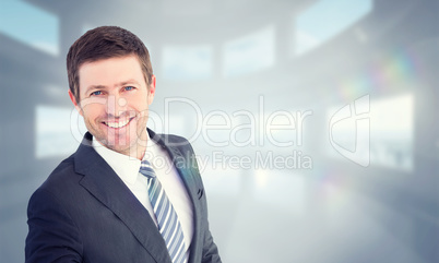 Composite image of businessman smiling and offering his hand