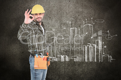 Composite image of smiling handyman gesturing okay