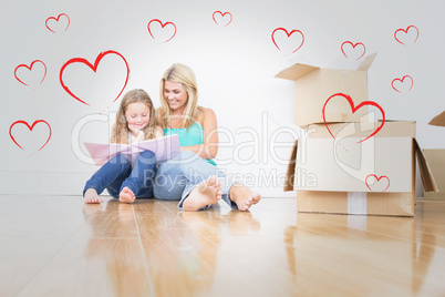 Composite image of mother and daughter reading a book