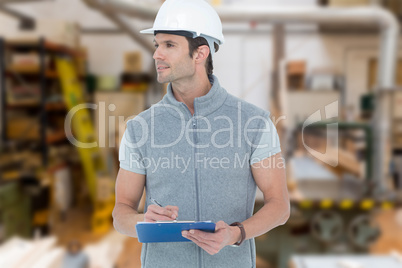 Composite image of architect writing on clip board