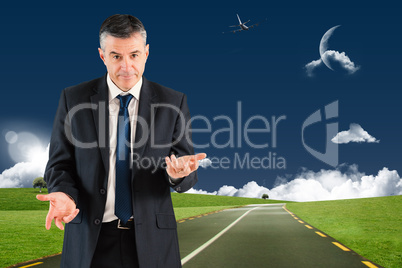 Composite image of mature businessman holding his hands out