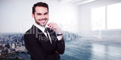 Composite image of stylish businessman smiling at camera