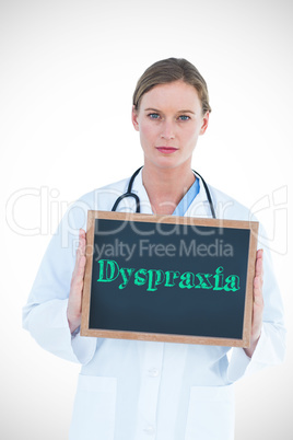 Dyspraxia against doctor showing chalkboard