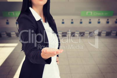 Composite image of pretty businesswoman presenting with hand