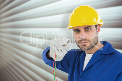 Composite image of confident repairman holding cables