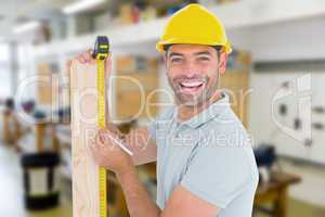 Composite image of construction worker using measure tape to mar