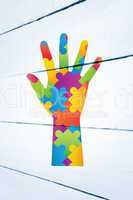 Composite image of autism awareness hand