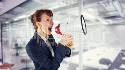 Composite image of businesswoman with loudspeaker