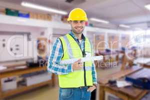 Composite image of portrait of smiling architect holding bluepri